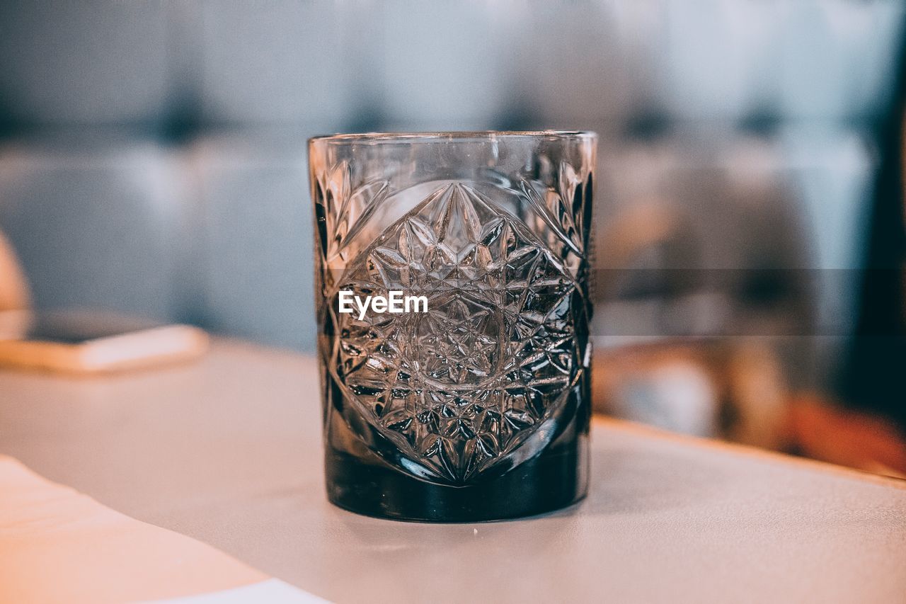 Close-up of drinking glass on table