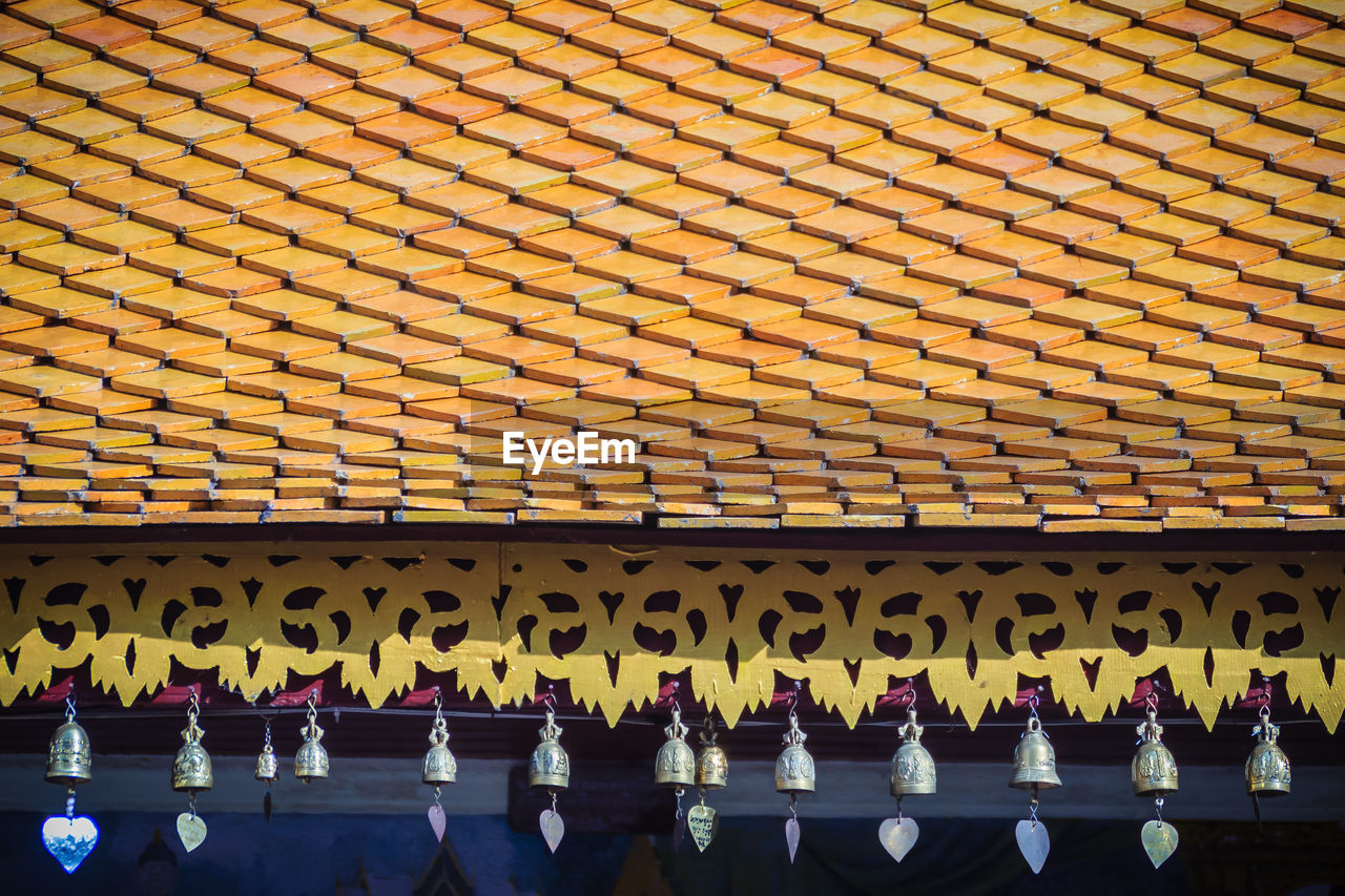 HIGH ANGLE VIEW OF PEOPLE STANDING ON COBBLESTONE