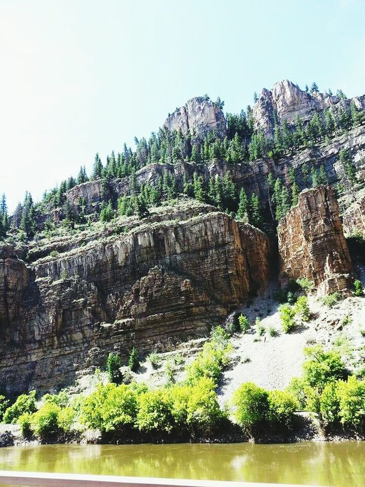 SCENIC VIEW OF ROCK FORMATIONS ON COAST