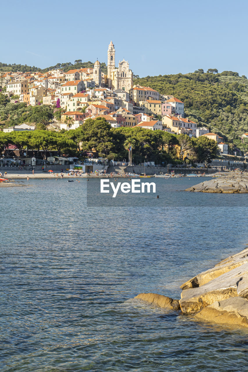  cervo beach with its characteristic rocks and the beautiful town in the background