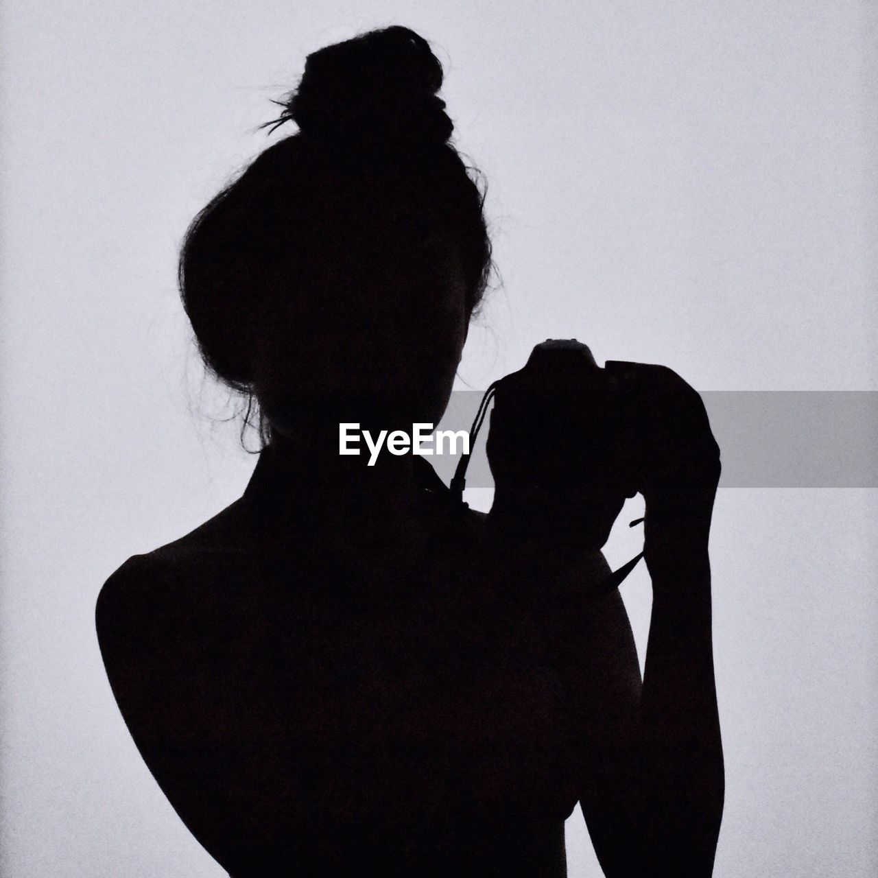 Silhouette woman standing against white background