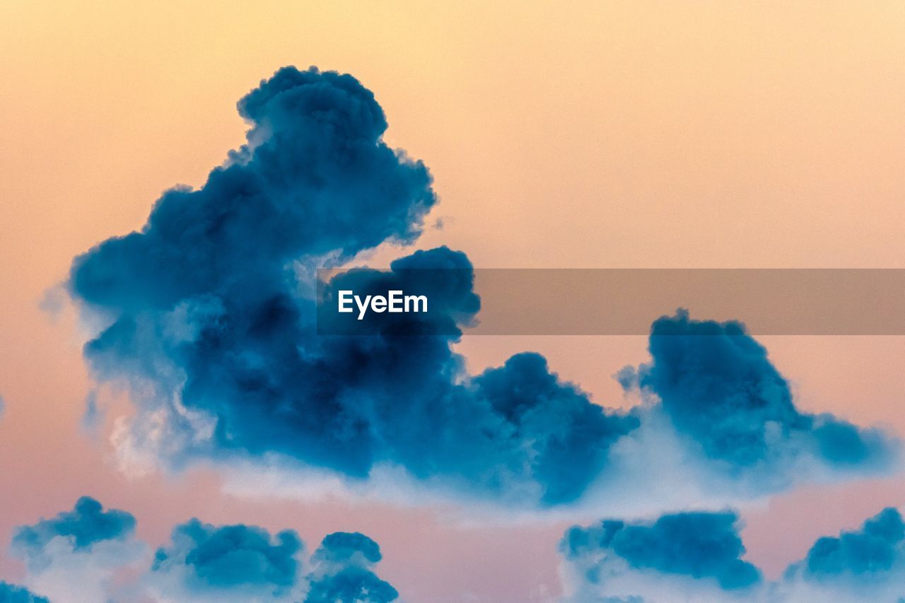 Low angle view of clouds in sky during sunset