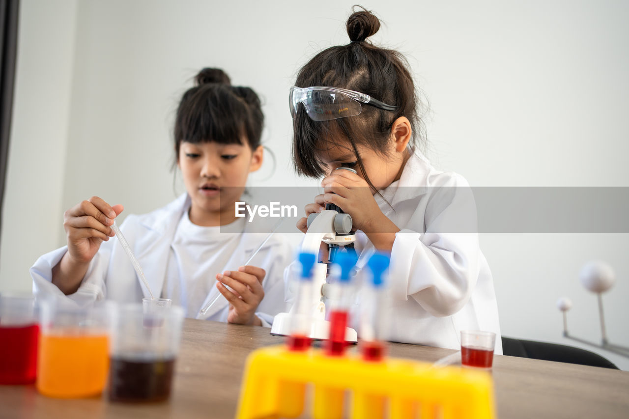 female doctor examining chemical at clinic