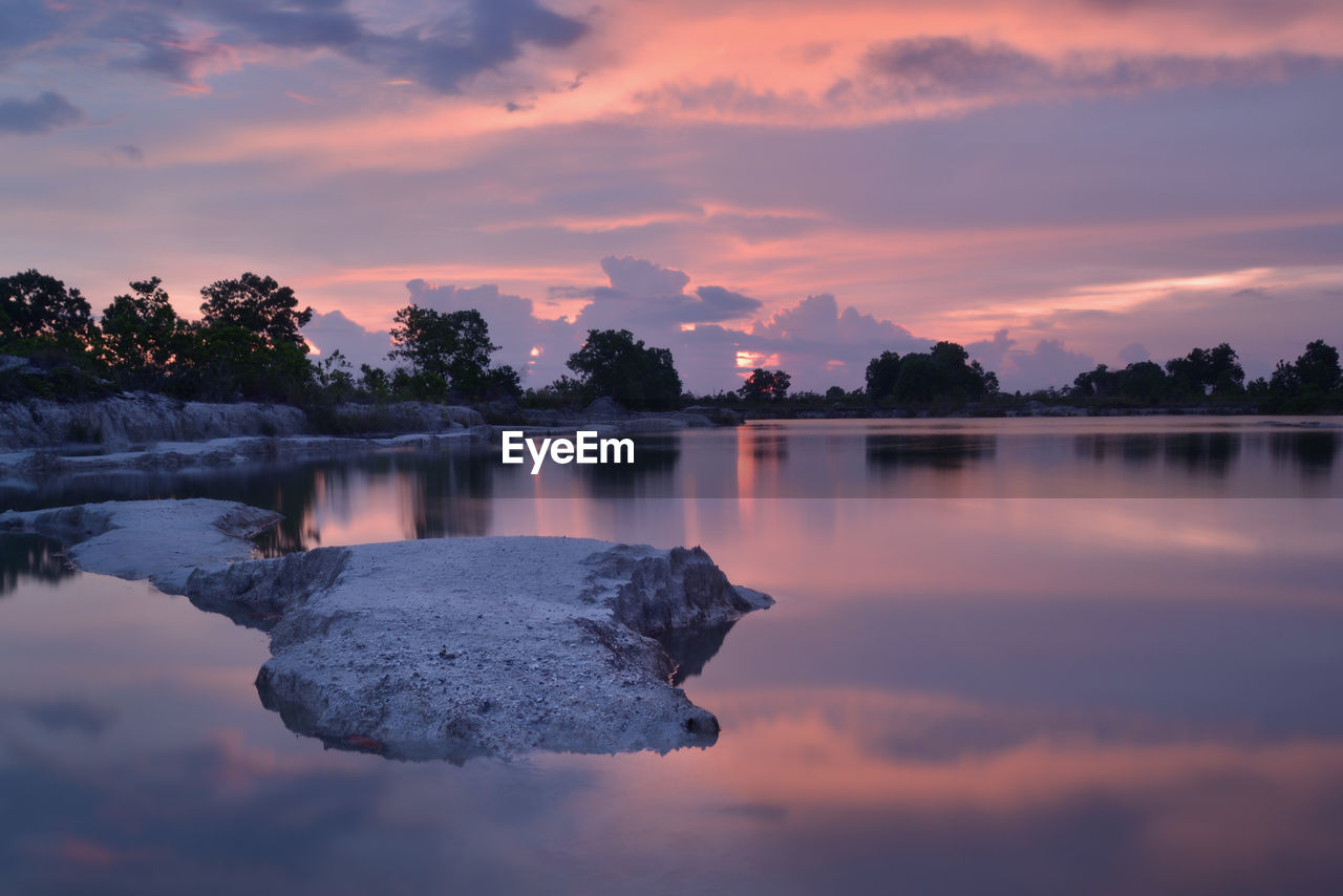 Scenic view of lake against sky during sunset