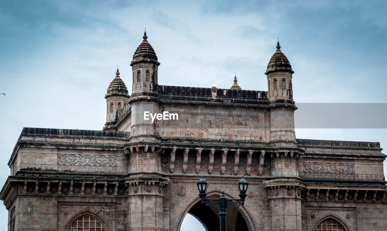 Low angle view of gateway of india against sky