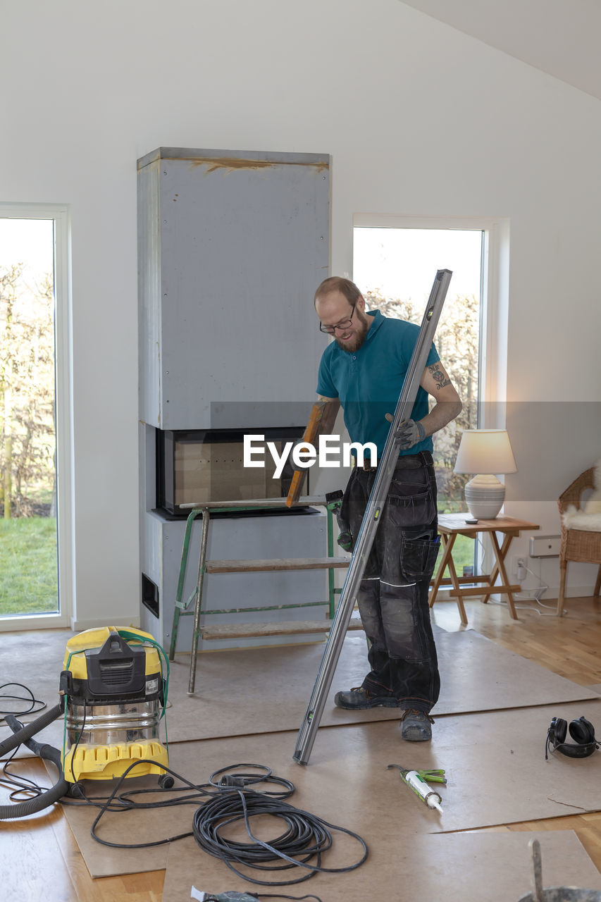 Man installing fireplace