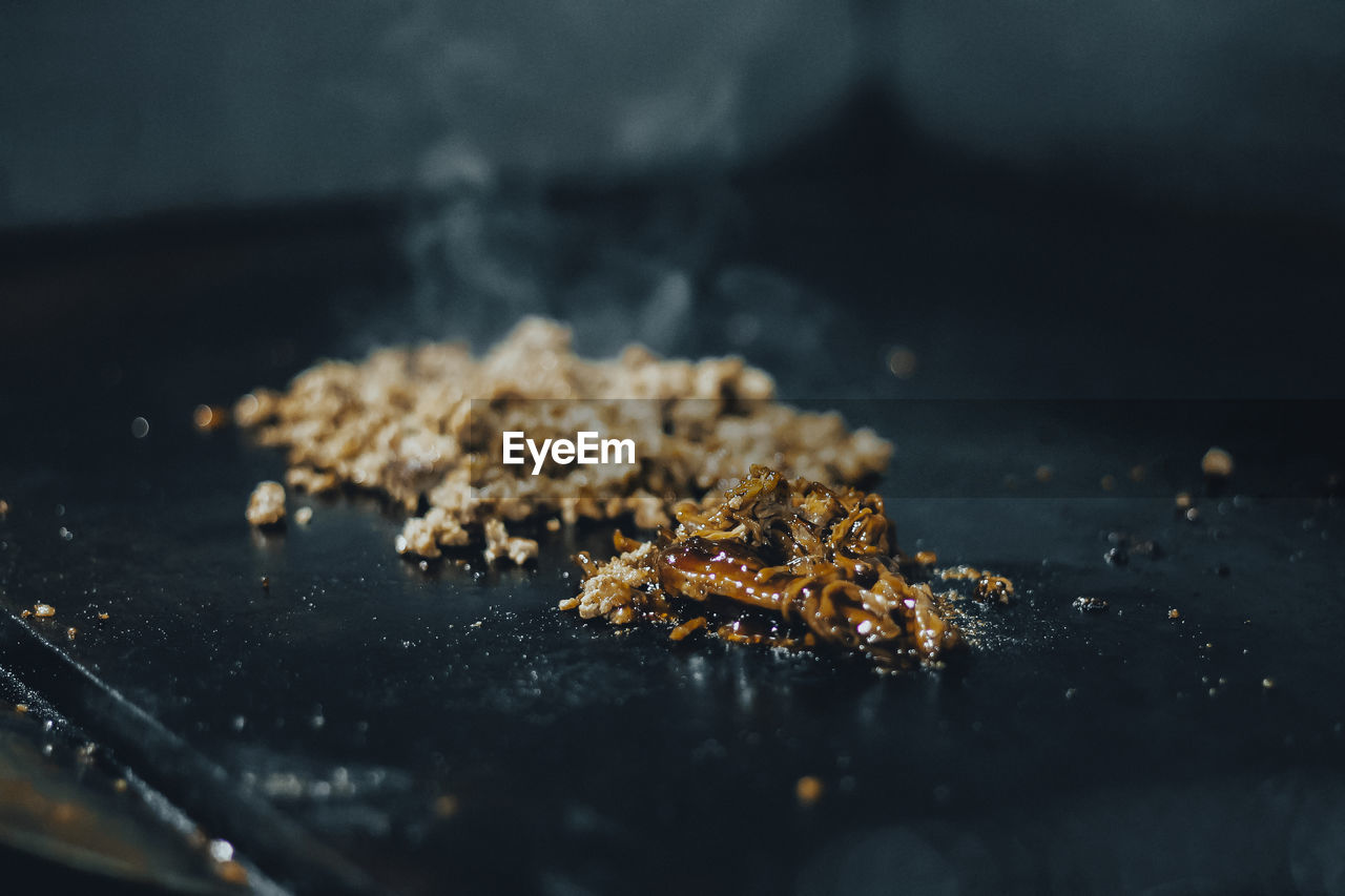 Close-up of food on table against black background