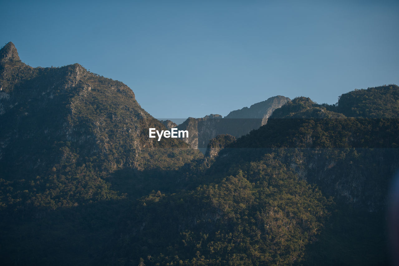 Scenic view of mountains against clear sky