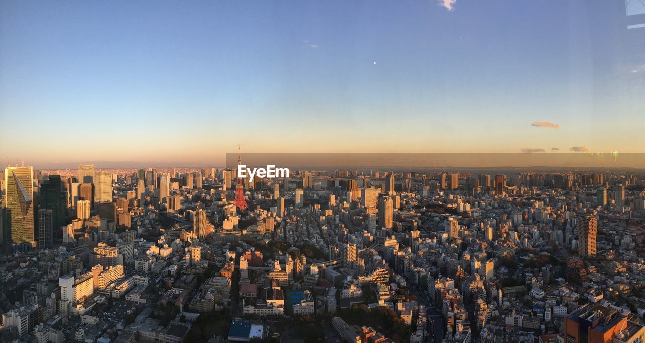 High angle view of city against sky during sunset