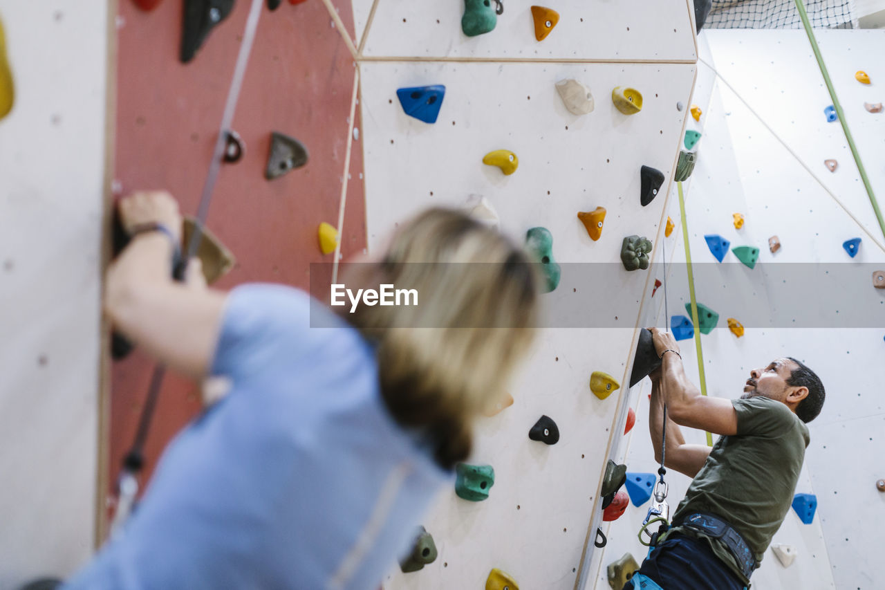 Man on climbing wall