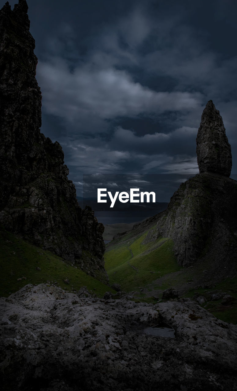 Rock formation on land against sky