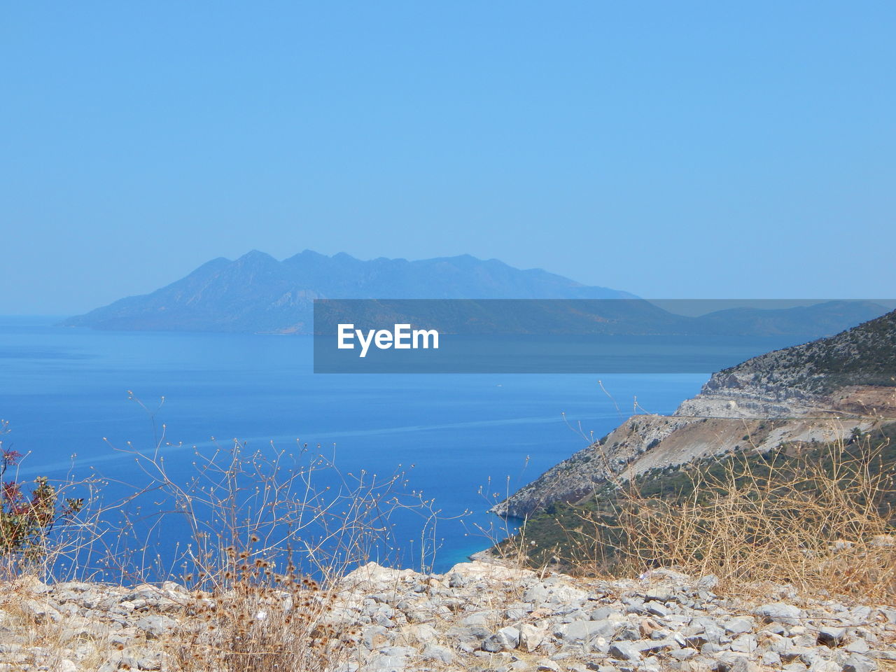 Scenic view of calm sea against clear sky