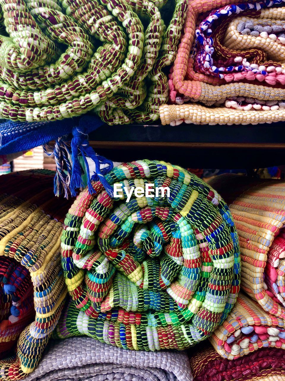 HIGH ANGLE VIEW OF MULTI COLORED WICKER BASKET