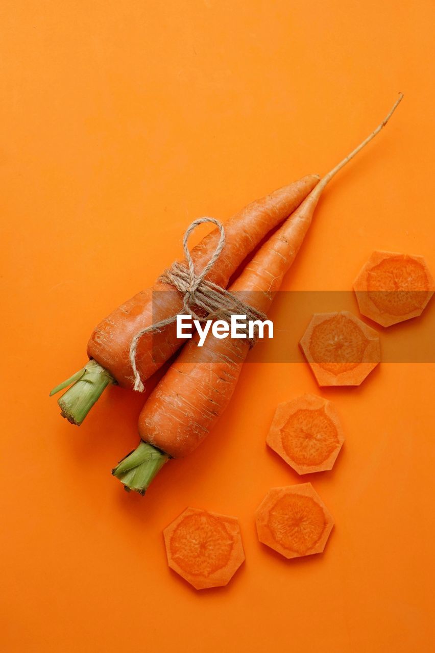 HIGH ANGLE VIEW OF EGGS IN ORANGE