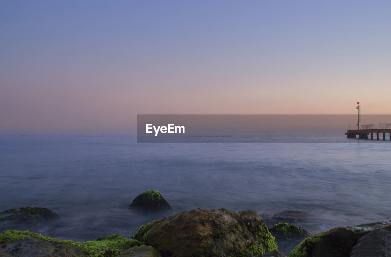 Scenic view of sea against clear sky