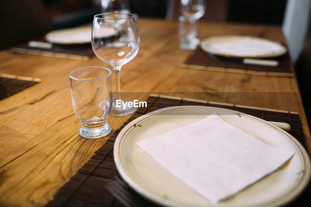 Close-up of place setting on table in restaurant