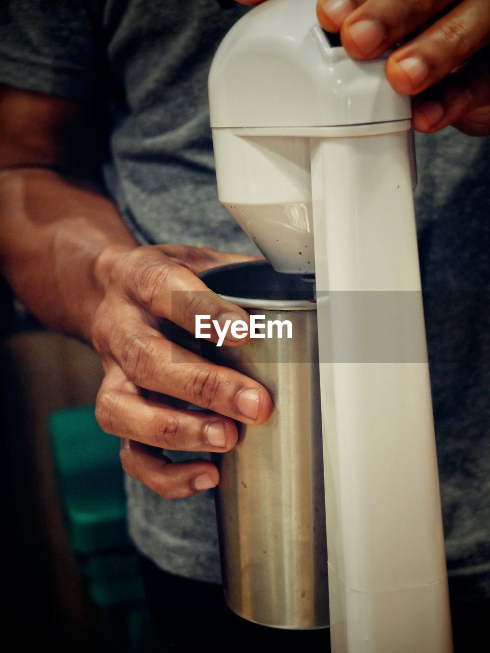 Midsection of man preparing refreshment drink