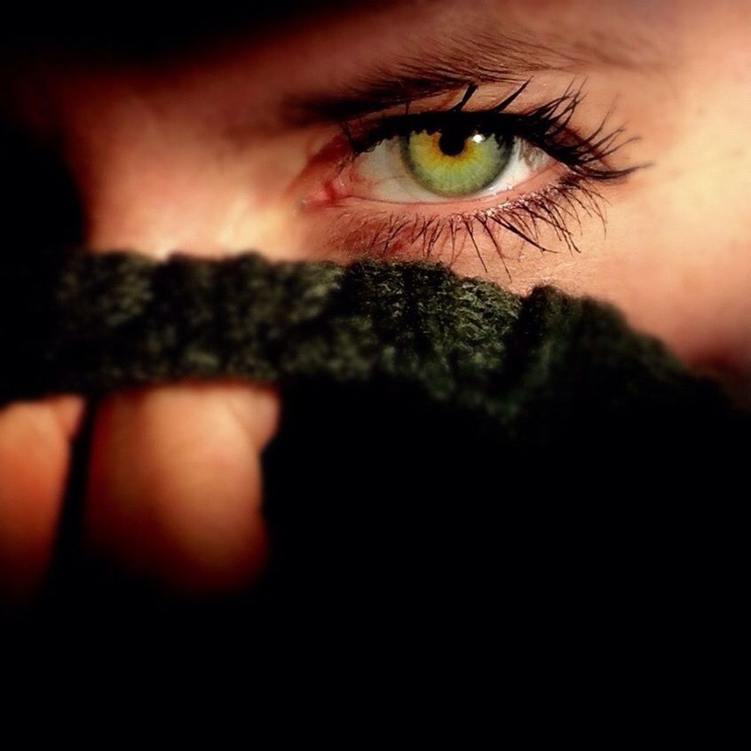Extreme close-up of woman with green eye