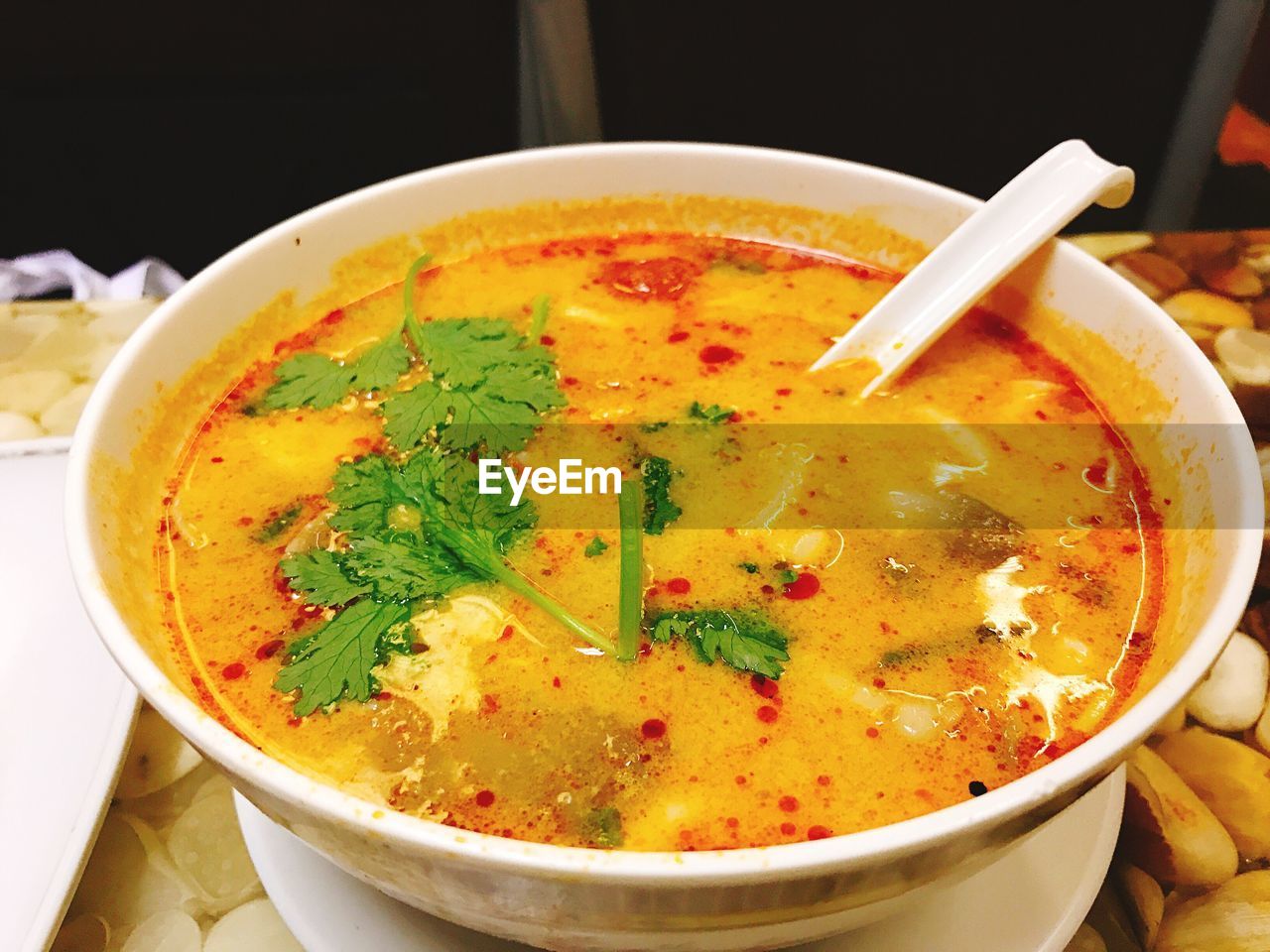 CLOSE-UP OF SOUP IN BOWL ON TABLE