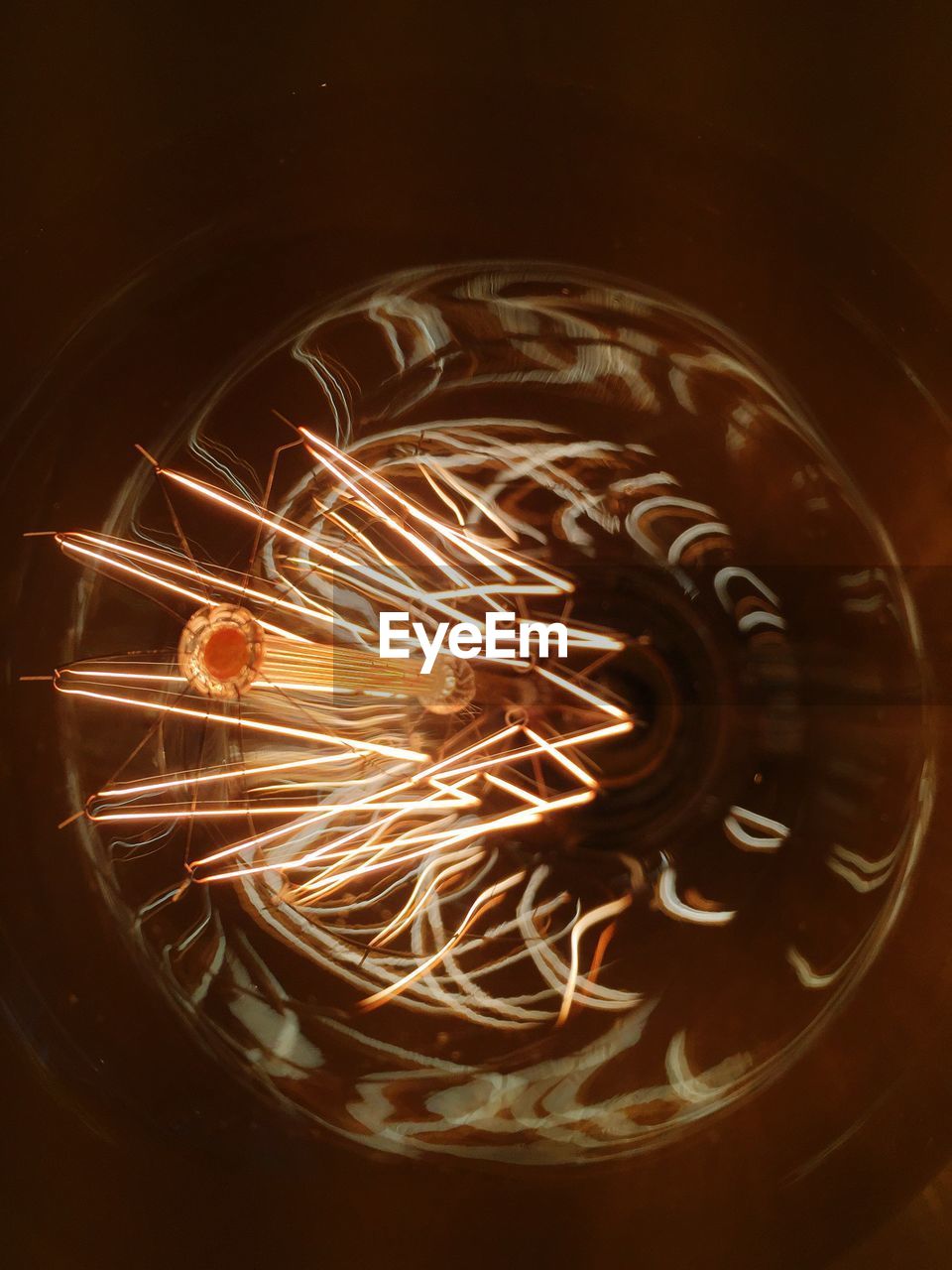 Close-up of illuminated light bulb