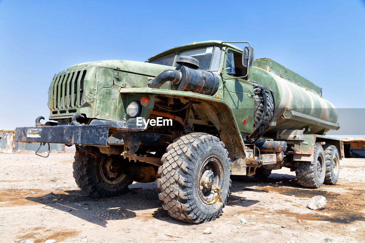 ABANDONED VINTAGE CAR ON LAND