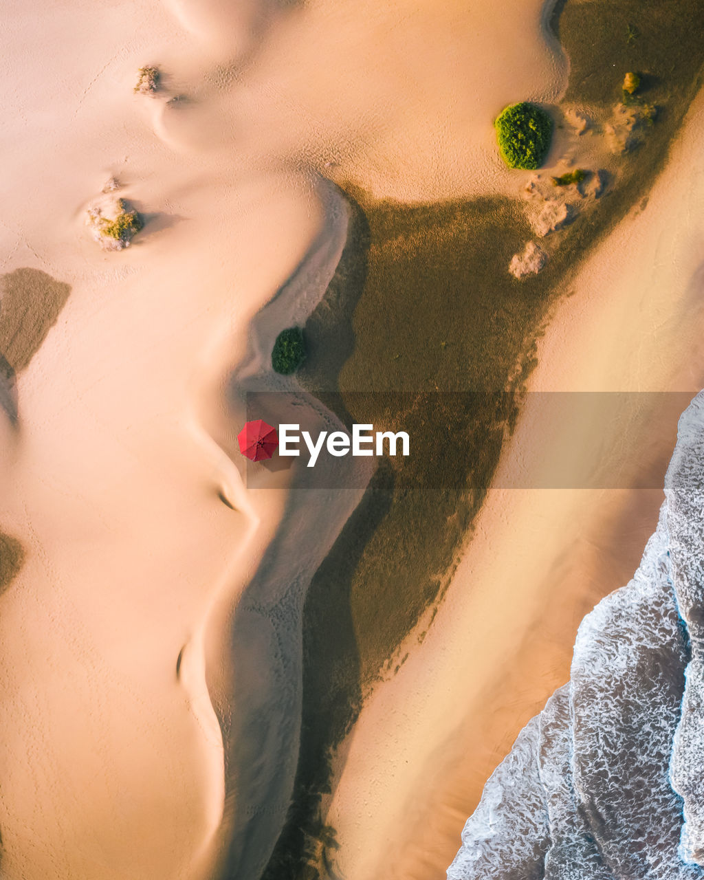 HIGH ANGLE VIEW OF WOMAN IN SAND AT DESERT