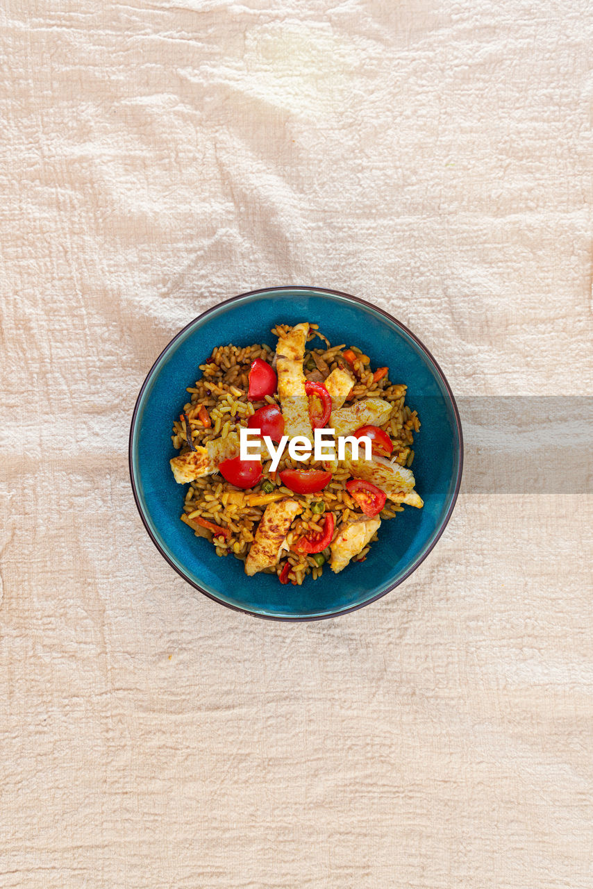 HIGH ANGLE VIEW OF BREAKFAST SERVED ON TABLE AGAINST WALL