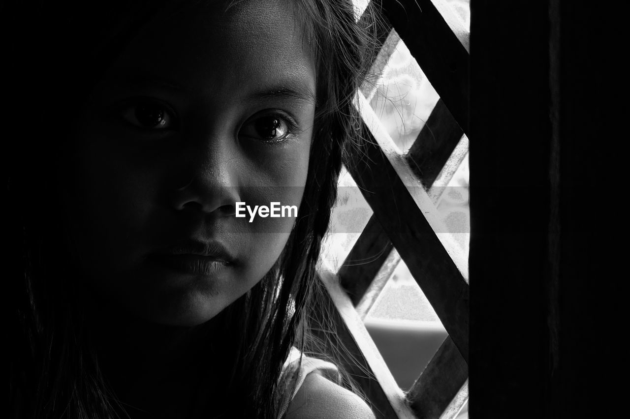 Close-up portrait of girl at home