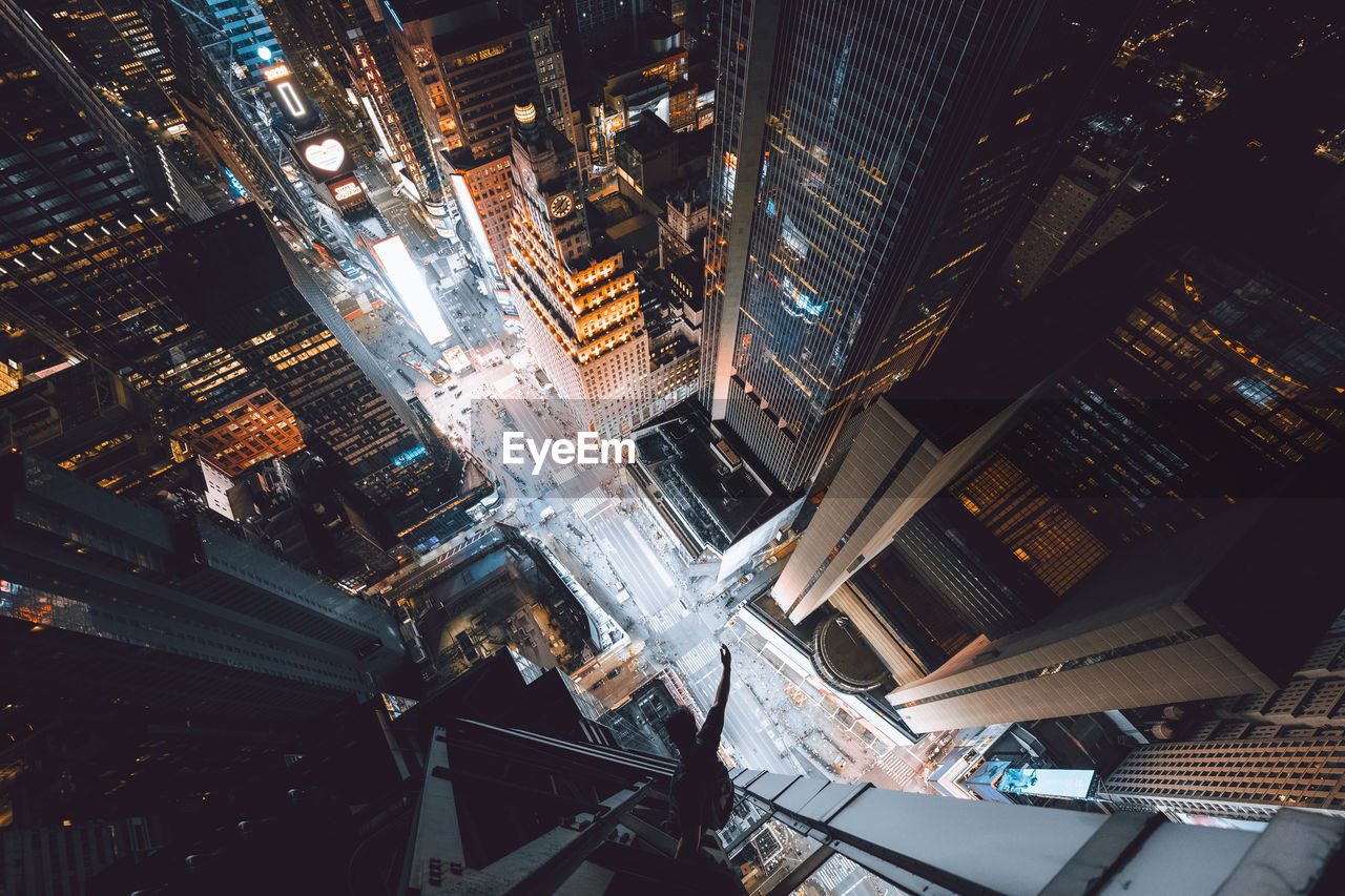 HIGH ANGLE VIEW OF MODERN BUILDINGS IN CITY AT NIGHT