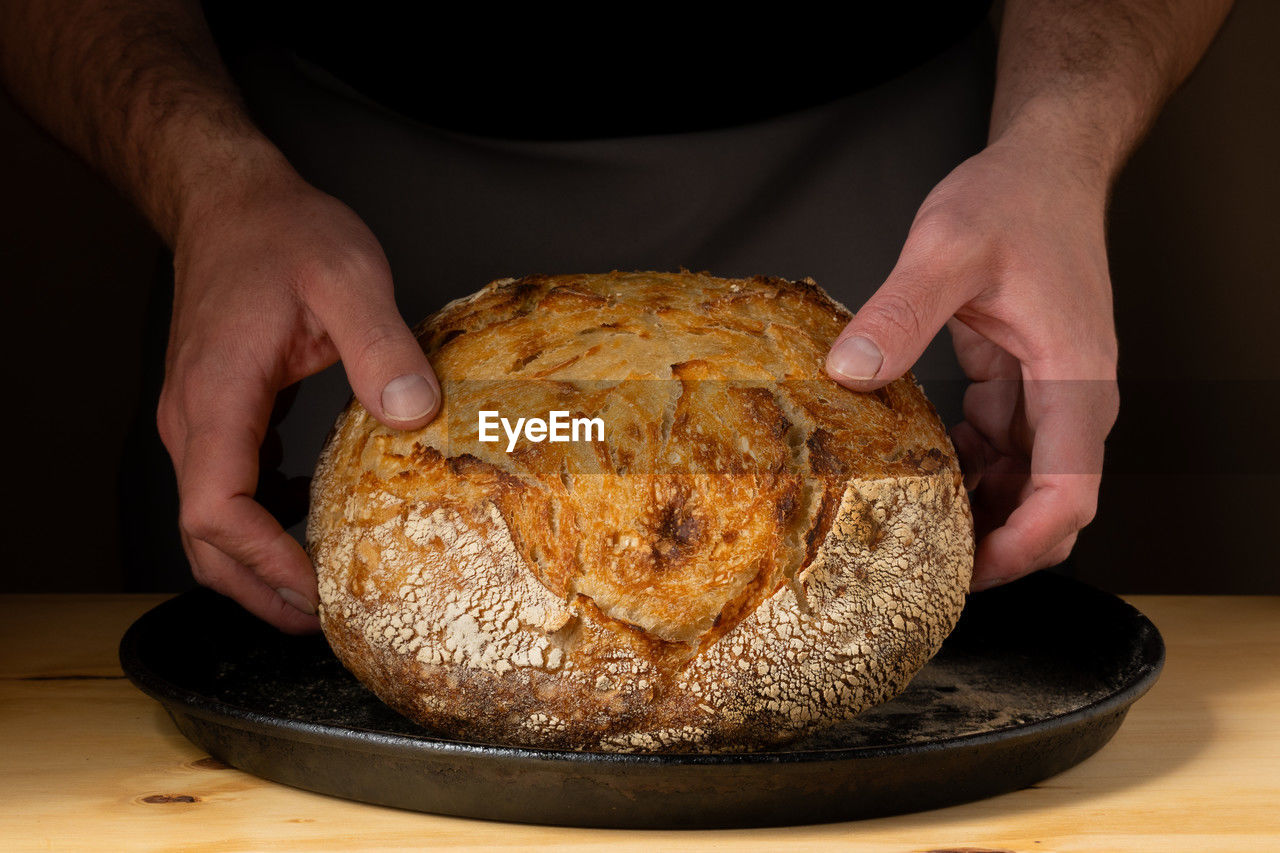 midsection of man preparing food on table