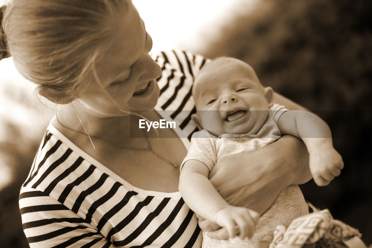 Close-up of mother holding baby boy