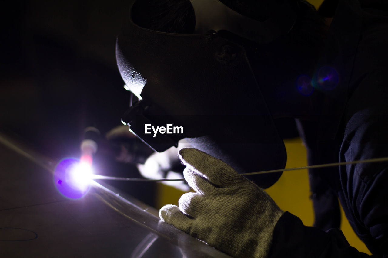 Man working on metal in workshop