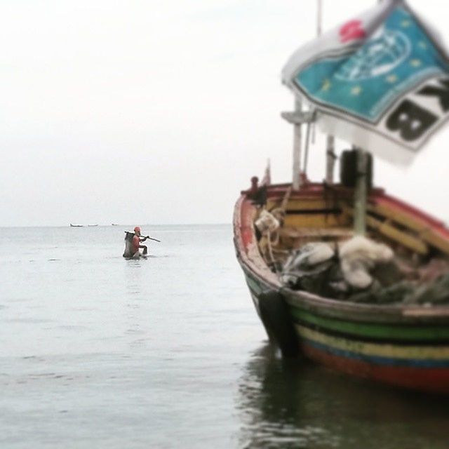 BOATS SAILING ON SEA