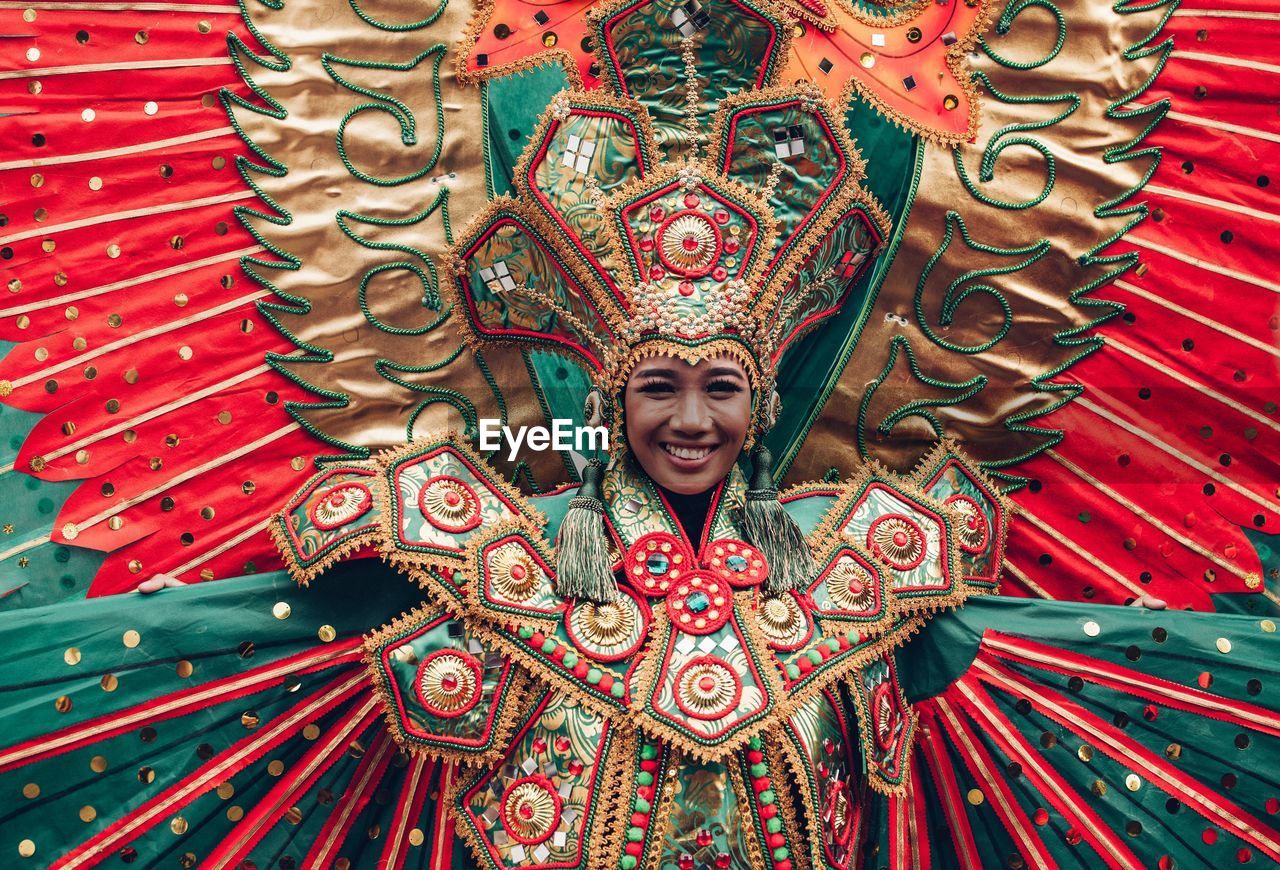 Portrait of smiling mid adult woman wearing costume during traditional festival