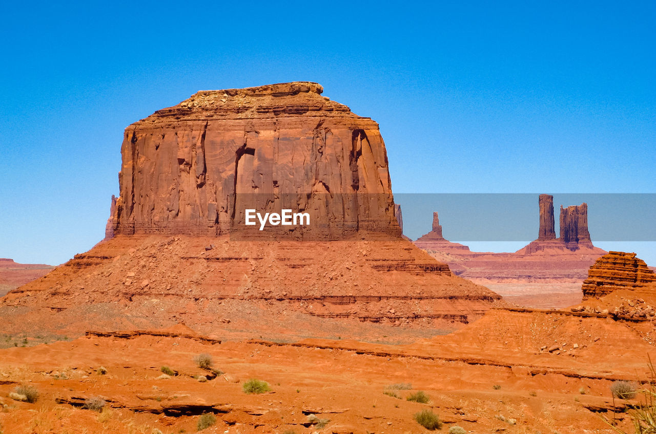 Rock formations against clear sky monument valley