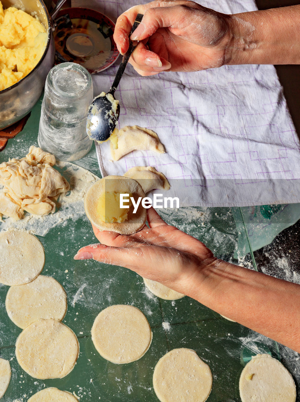 Midsection of woman preparing food in kitchen