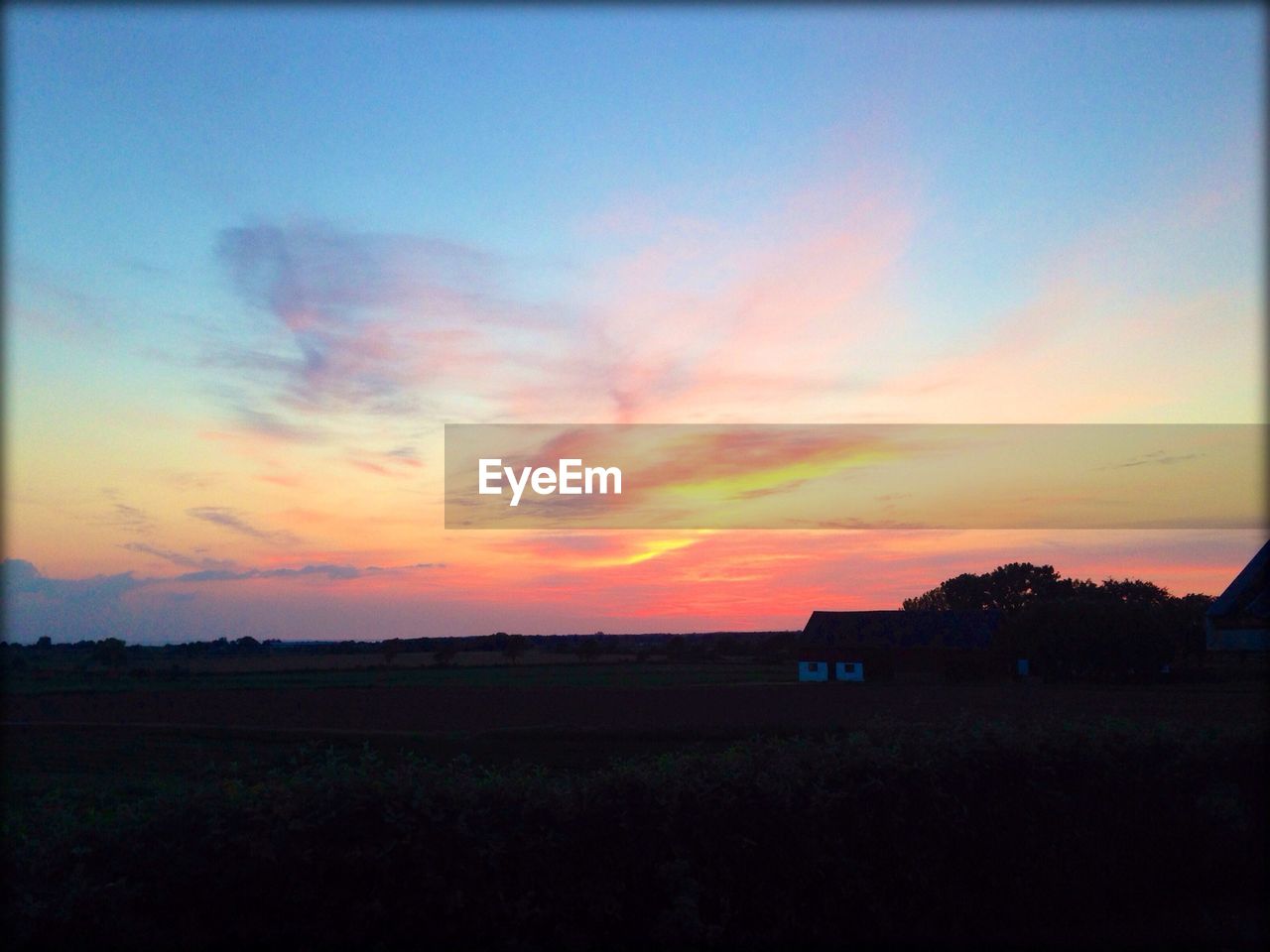 Scenic view of landscape against sky during sunset