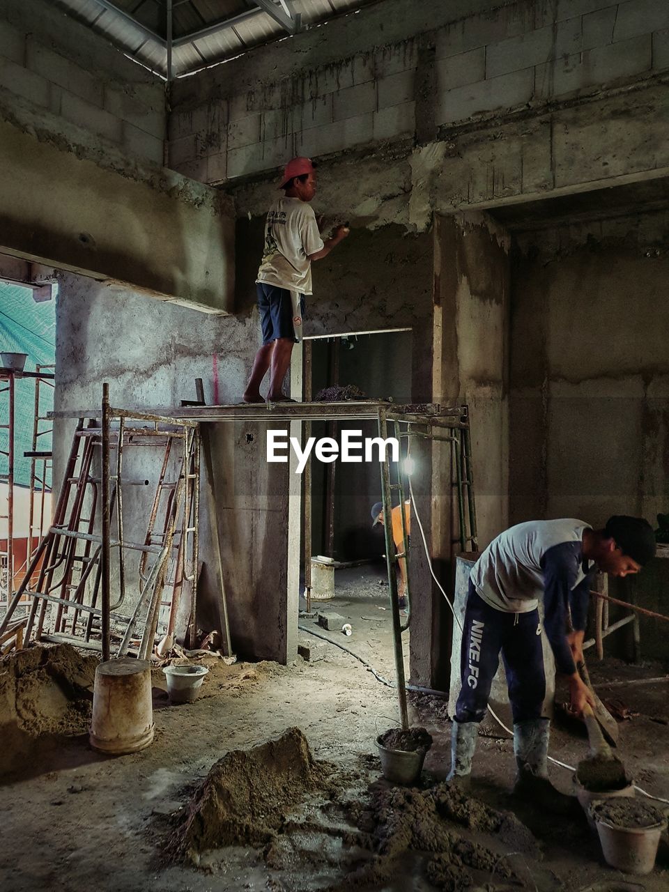 PEOPLE WORKING ON CONSTRUCTION SITE