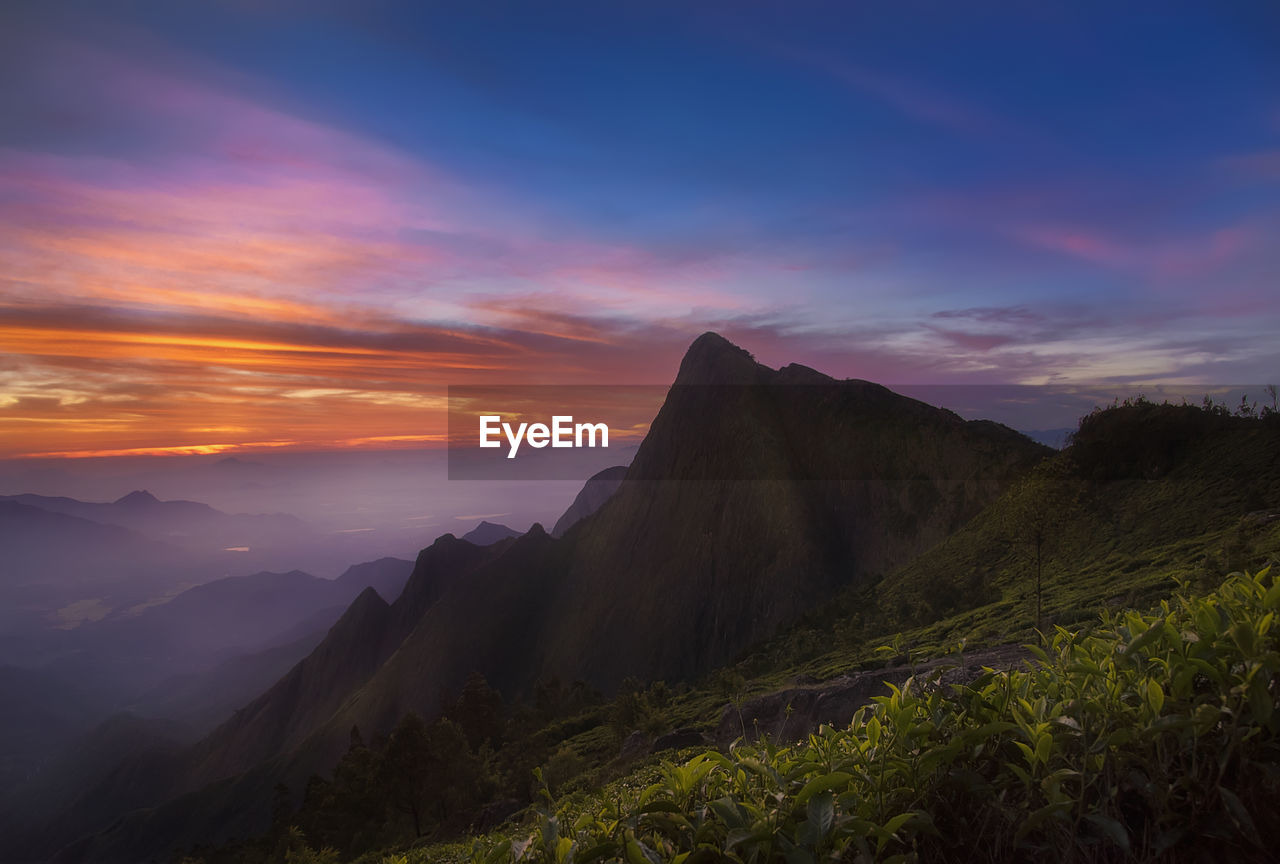 Scenic view of mountains against sky during sunset