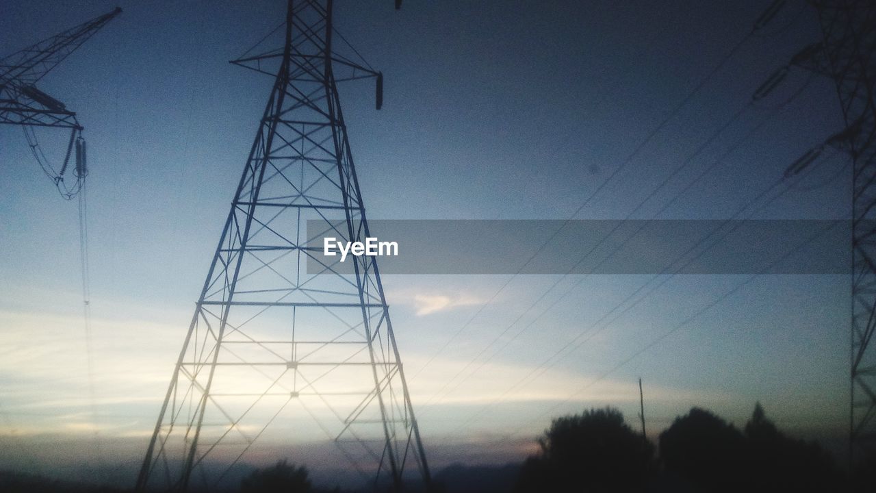 LOW ANGLE VIEW OF ELECTRICITY PYLONS AGAINST SKY
