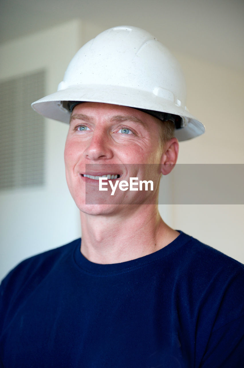 Portrait of young man in hard hat