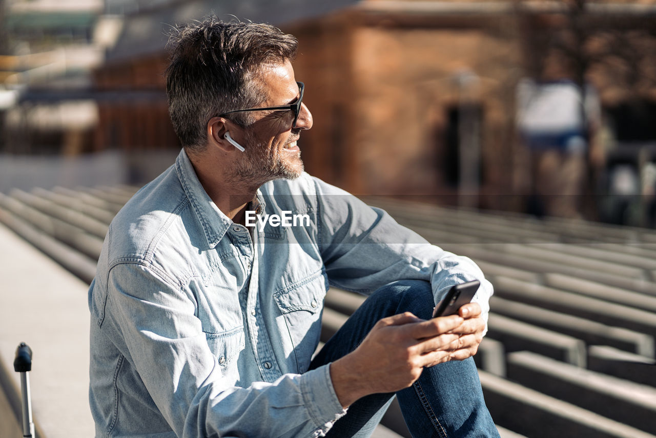 Young man looking away outdoors