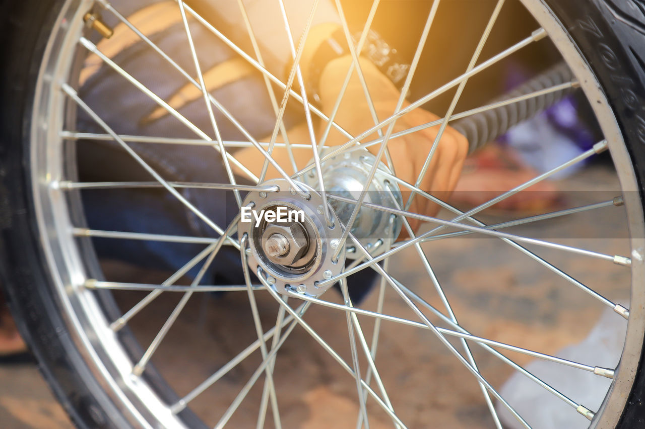 CLOSE-UP OF A BICYCLE ON METAL