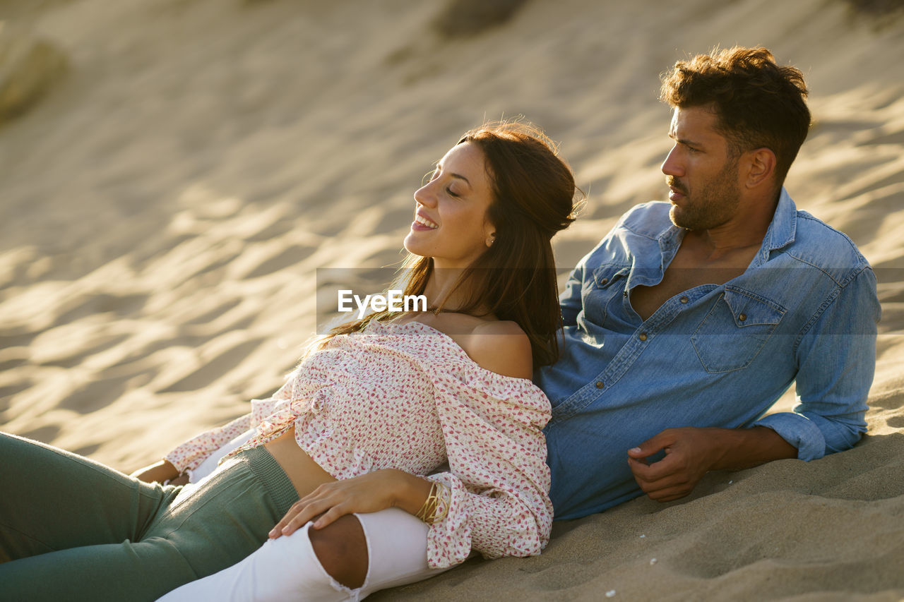 Couple relaxing on beach