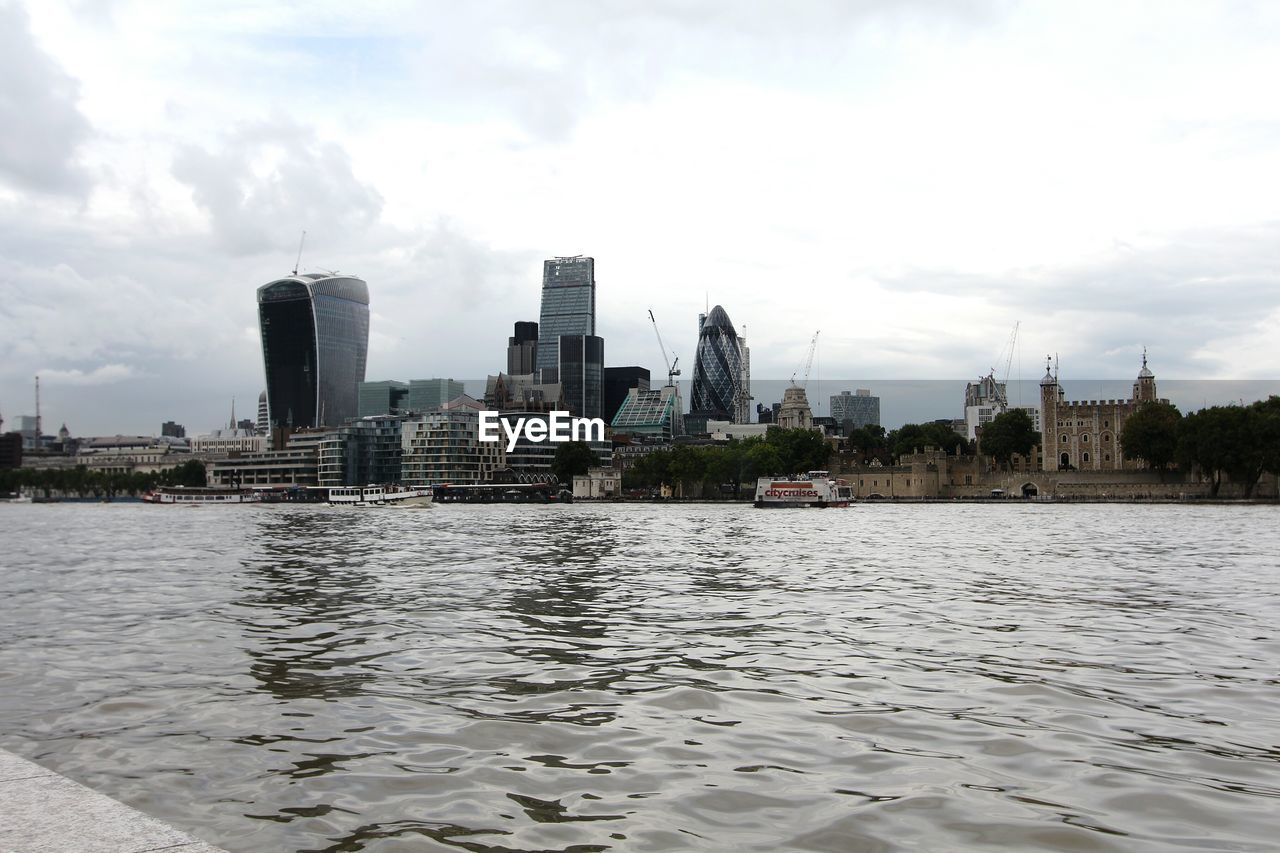 River by city with 30 st mary axe against sky