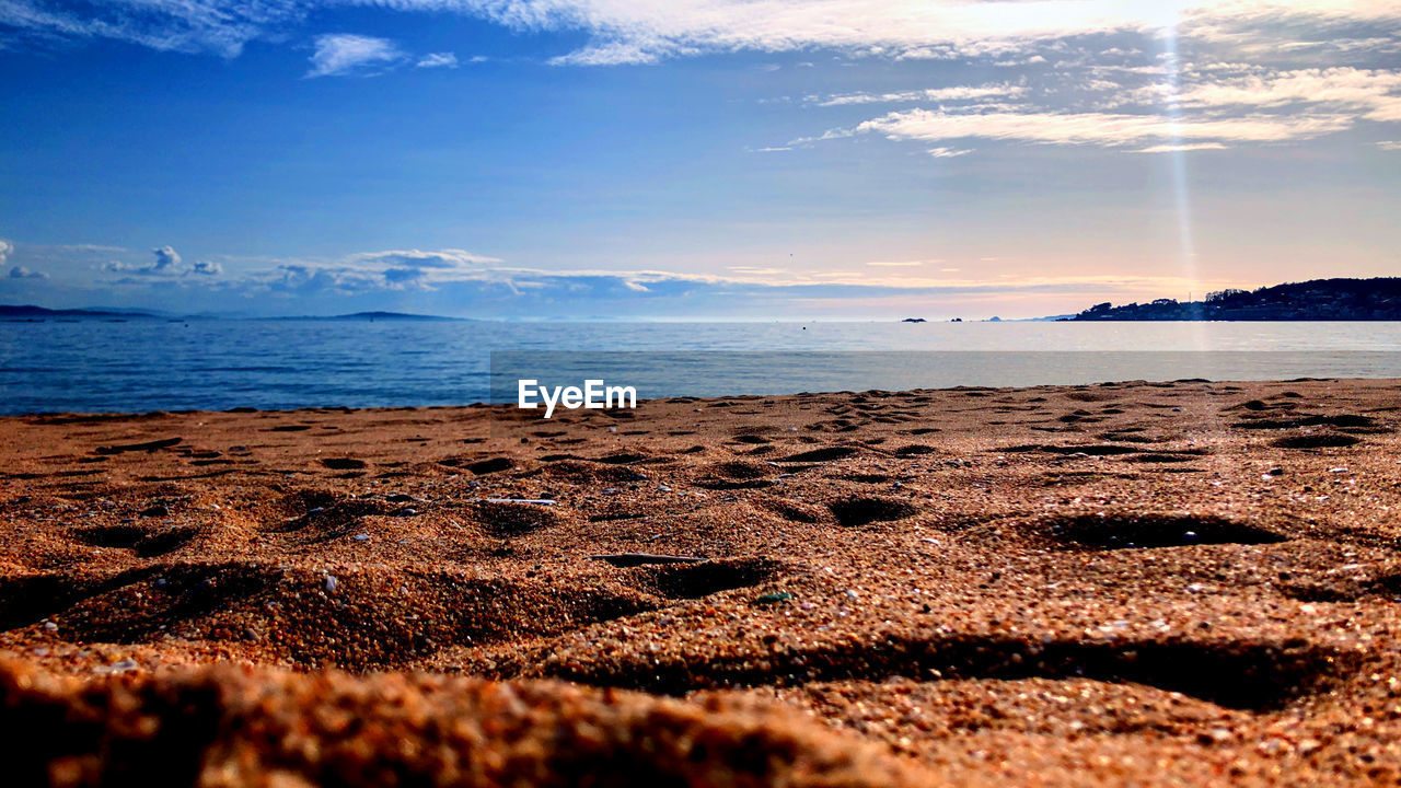 SCENIC VIEW OF SEA AGAINST SKY AT SUNSET