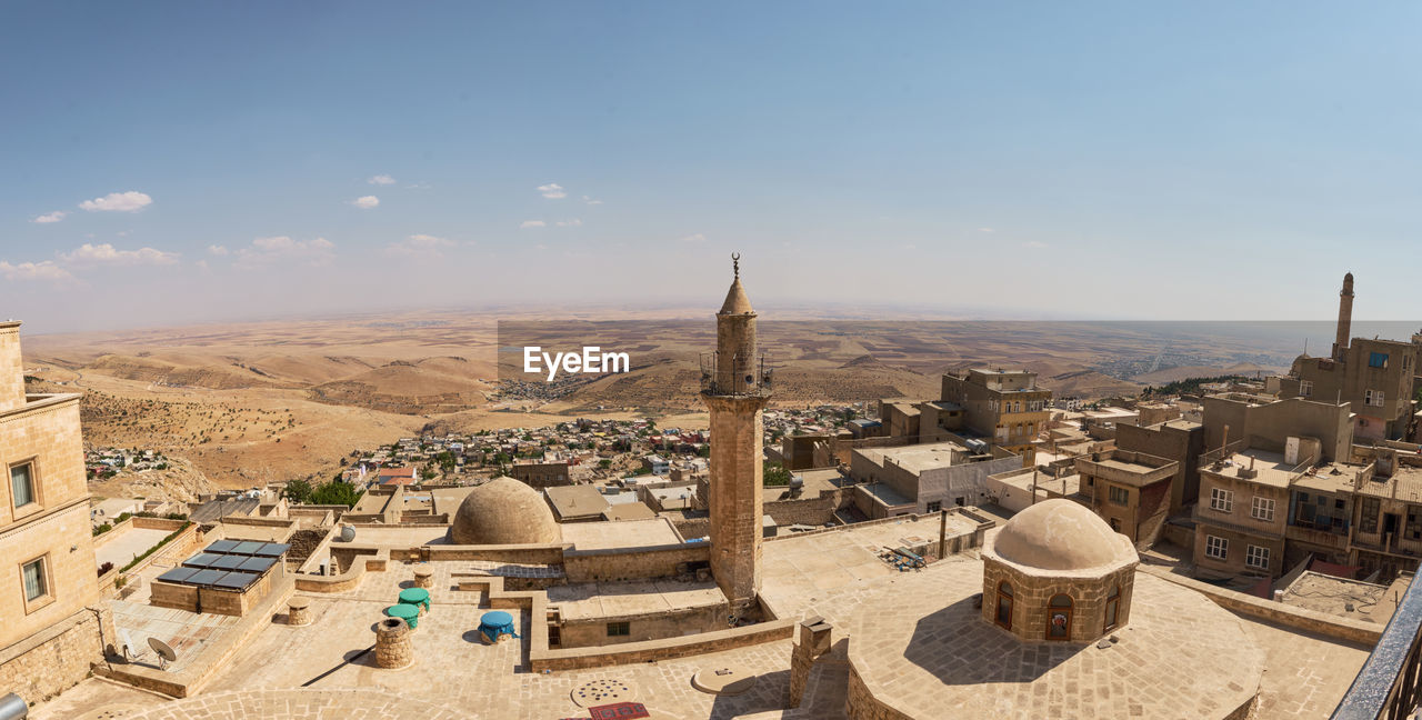 Panoramic view of roofs, mosques and historic buildings of mesopotamian city of mardin, turkey