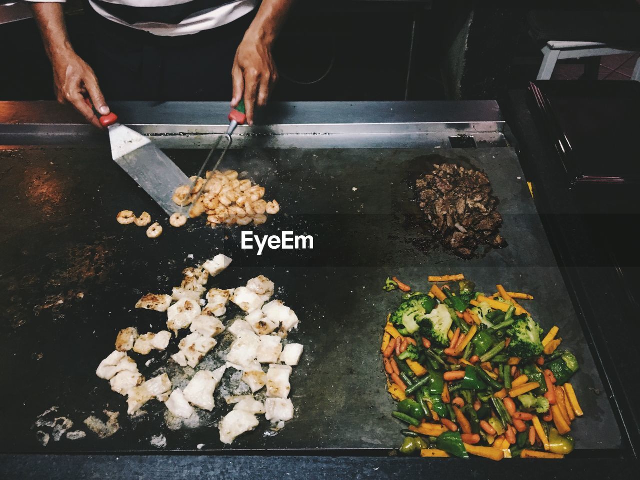 Midsection of chef preparing food in kitchen