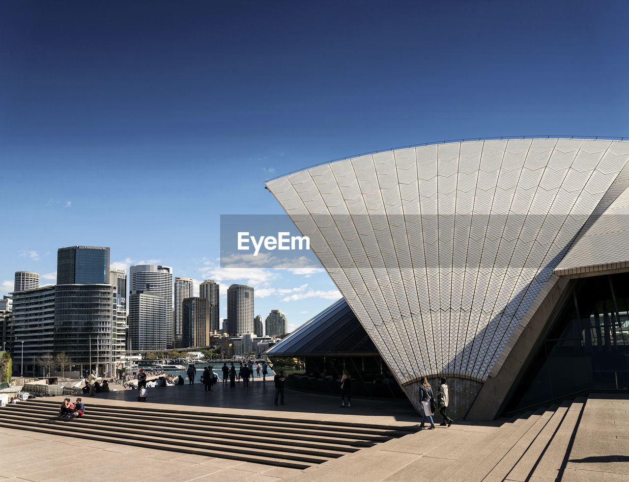 MODERN BUILDINGS AGAINST CLEAR BLUE SKY