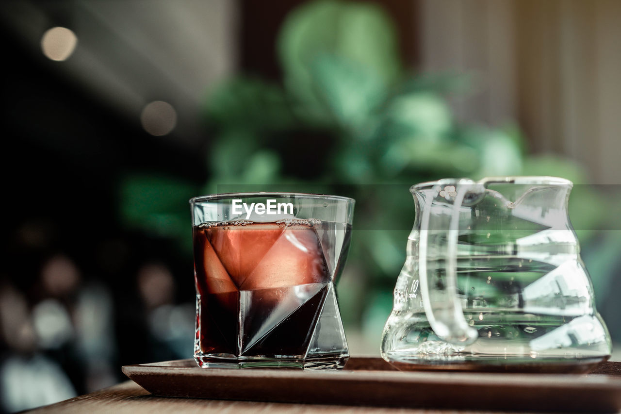 CLOSE-UP OF DRINK IN GLASS